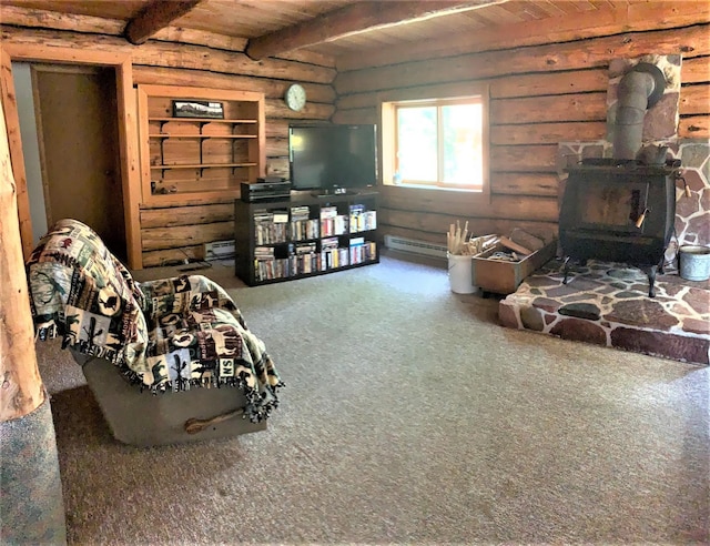 7191 Boy Scout Rd, Seeley Lake, MT 59868 - carpeted living area featuring rustic walls, a wood stove, wooden ceiling with exposed beams, a baseboard radiator, and baseboard heating