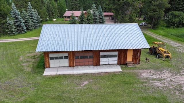 7191 Boy Scout Rd, Seeley Lake, MT 59868 - garage featuring a garage and a view of trees