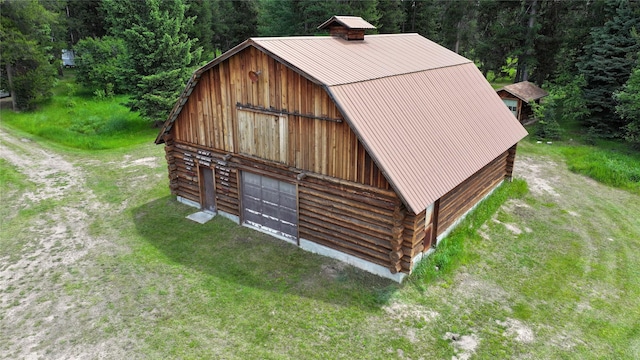 7191 Boy Scout Rd, Seeley Lake, MT 59868 - view of barn featuring a view of trees