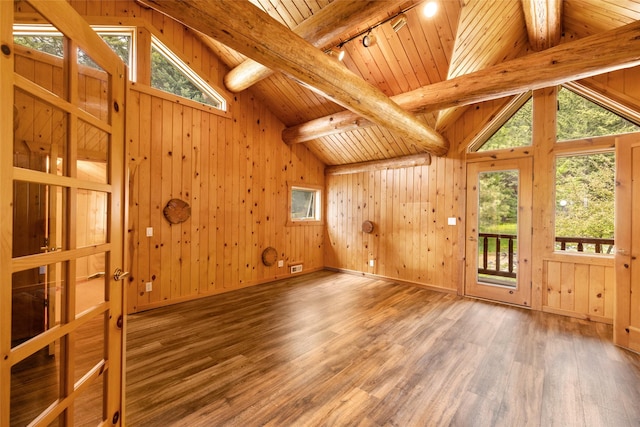 1473 Foothill Rd, Kalispell, MT 59901 - empty room featuring wood finished floors, wooden ceiling, plenty of natural light, wooden walls, and track lighting