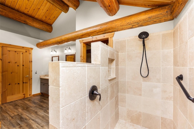 1473 Foothill Rd, Kalispell, MT 59901 - bathroom featuring a tile shower, wood finished floors, vanity, and wood ceiling