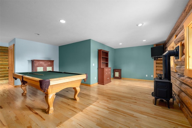 1473 Foothill Rd, Kalispell, MT 59901 - playroom featuring pool table, light wood finished floors, recessed lighting, and a wood stove