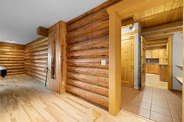 1473 Foothill Rd, Kalispell, MT 59901 - hallway with rustic walls and light wood-style floors