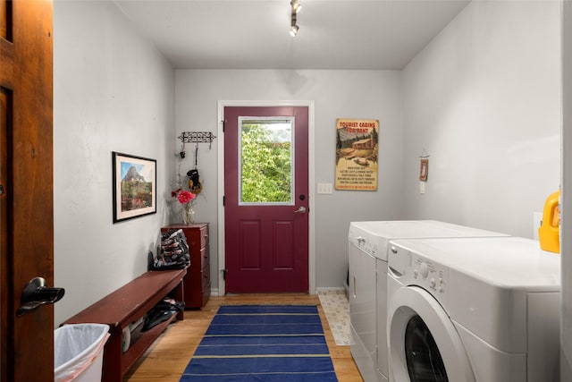 1473 Foothill Rd, Kalispell, MT 59901 - laundry area featuring separate washer and dryer and light wood-type flooring