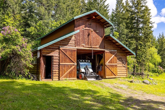 1473 Foothill Rd, Kalispell, MT 59901 - view of barn featuring a yard