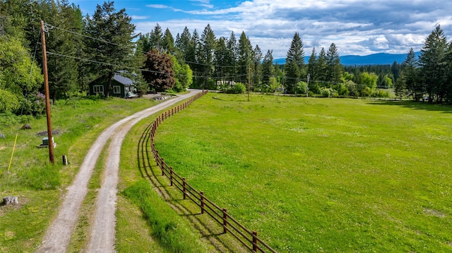 1473 Foothill Rd, Kalispell, MT 59901 - view of yard with driveway and a forest view