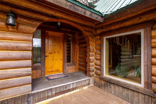 1473 Foothill Rd, Kalispell, MT 59901 - property entrance featuring log siding and a metal roof