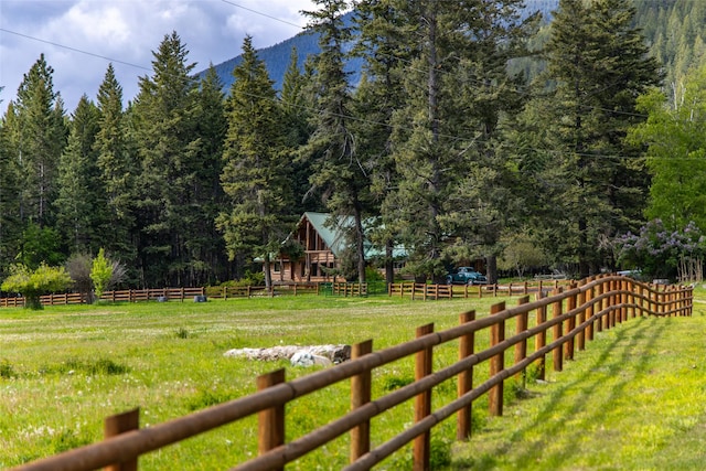 1473 Foothill Rd, Kalispell, MT 59901 - view of yard featuring a wooded view and a mountain view