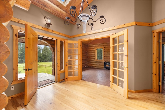 1473 Foothill Rd, Kalispell, MT 59901 - entryway with french doors, log walls, high vaulted ceiling, wood finished floors, and wood ceiling