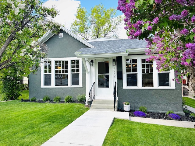 322 W Lawrence St, Helena, MT 59601 - bungalow with a front lawn, stucco siding, and a shingled roof