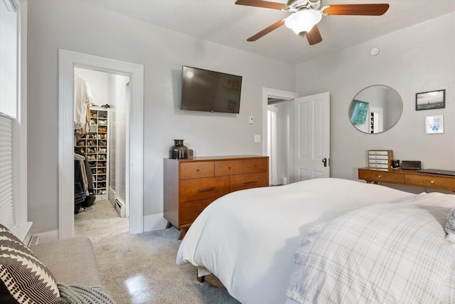 322 W Lawrence St, Helena, MT 59601 - bedroom with light colored carpet, a spacious closet, and a ceiling fan