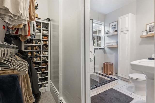 322 W Lawrence St, Helena, MT 59601 - bathroom featuring radiator, a stall shower, and toilet