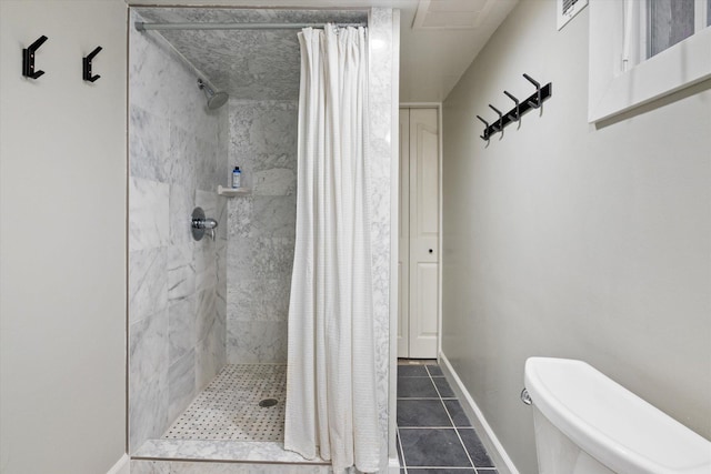 322 W Lawrence St, Helena, MT 59601 - bathroom featuring a stall shower, tile patterned floors, toilet, and baseboards