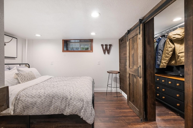 322 W Lawrence St, Helena, MT 59601 - bedroom featuring a barn door, dark wood-style flooring, baseboards, and recessed lighting