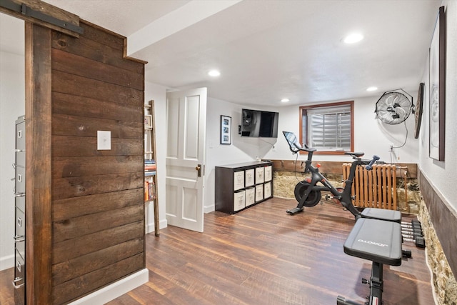 322 W Lawrence St, Helena, MT 59601 - workout room featuring wood finished floors, recessed lighting, baseboards, and radiator