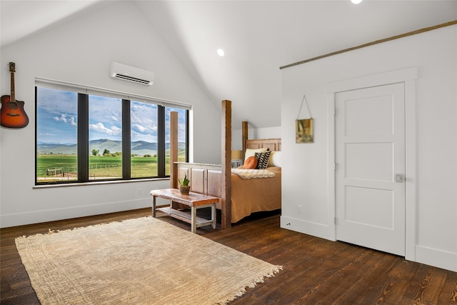 42730 Ridgeway Rd, Charlo, MT 59824 - bedroom featuring a wall unit AC, lofted ceiling, dark wood-type flooring, baseboards, and recessed lighting