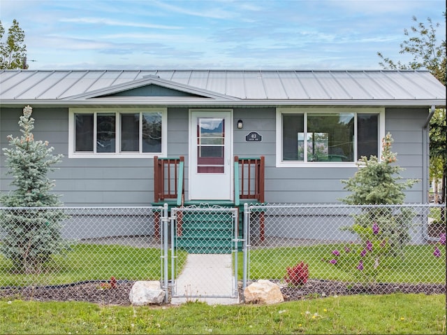 413 S Oak St, Townsend, MT 59644 - view of front of house with a gate, metal roof, and a standing seam roof