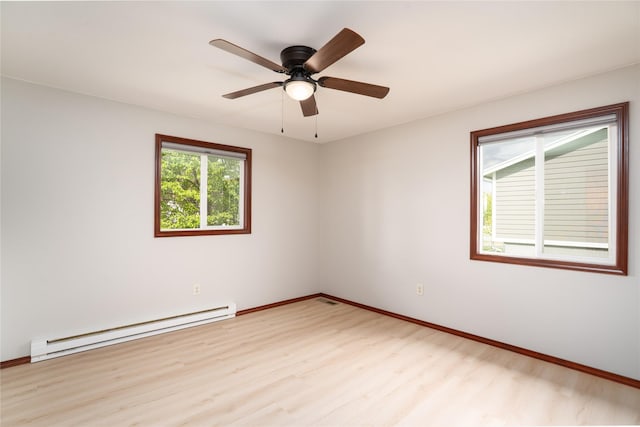 413 S Oak St, Townsend, MT 59644 - empty room featuring a baseboard heating unit, light wood-style floors, baseboards, and ceiling fan