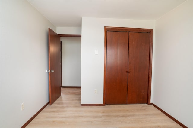 413 S Oak St, Townsend, MT 59644 - unfurnished bedroom with light wood finished floors, a closet, and baseboards