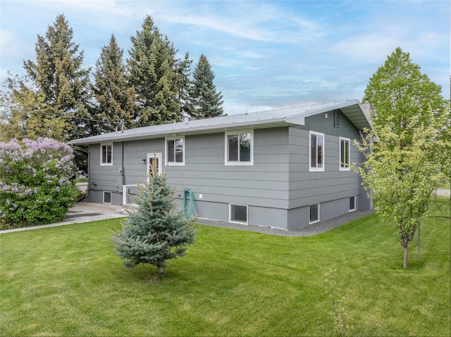 413 S Oak St, Townsend, MT 59644 - back of house with a chimney and a yard