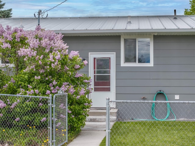 413 S Oak St, Townsend, MT 59644 - doorway to property with metal roof and a gate