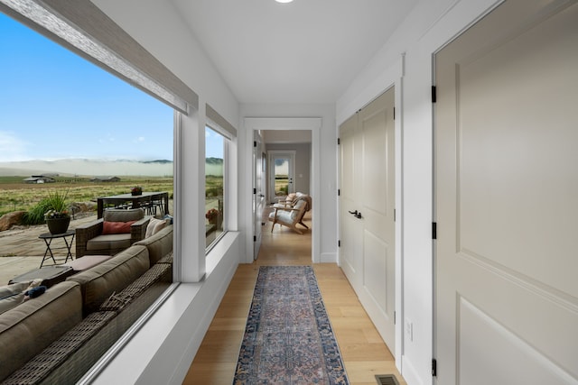 4910 Lauryn Ct, Helena, MT 59602 - hallway featuring light wood-style floors and a mountain view