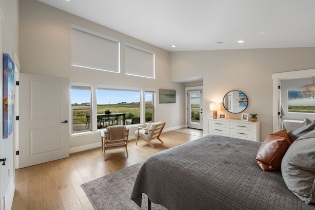 4910 Lauryn Ct, Helena, MT 59602 - bedroom with high vaulted ceiling, light wood-style flooring, recessed lighting, and baseboards
