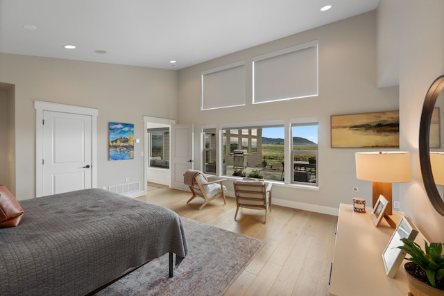 4910 Lauryn Ct, Helena, MT 59602 - bedroom with a towering ceiling, baseboards, light wood-style floors, and recessed lighting