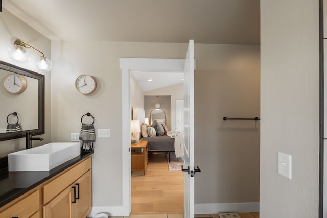 4910 Lauryn Ct, Helena, MT 59602 - bathroom featuring vanity, wood finished floors, and baseboards