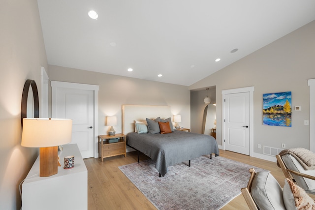4910 Lauryn Ct, Helena, MT 59602 - bedroom featuring vaulted ceiling, light wood-style floors, and recessed lighting