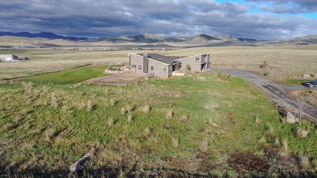 4910 Lauryn Ct, Helena, MT 59602 - aerial overview of property's location featuring a mountain backdrop and rural landscape