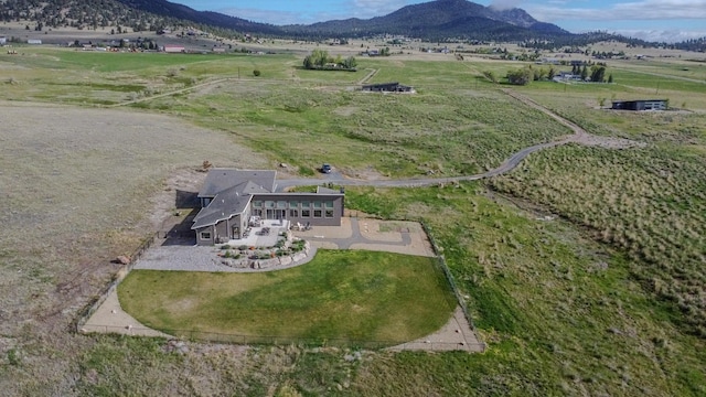 4910 Lauryn Ct, Helena, MT 59602 - aerial overview of property's location with rural landscape and a mountain backdrop