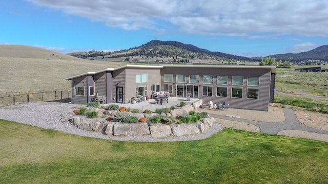 4910 Lauryn Ct, Helena, MT 59602 - rear view of house with a mountain view and a patio