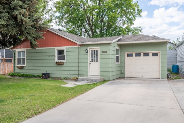 2109 S 5th St W, Missoula, MT 59801 - ranch-style house with an attached garage, a front lawn, driveway, and a shingled roof