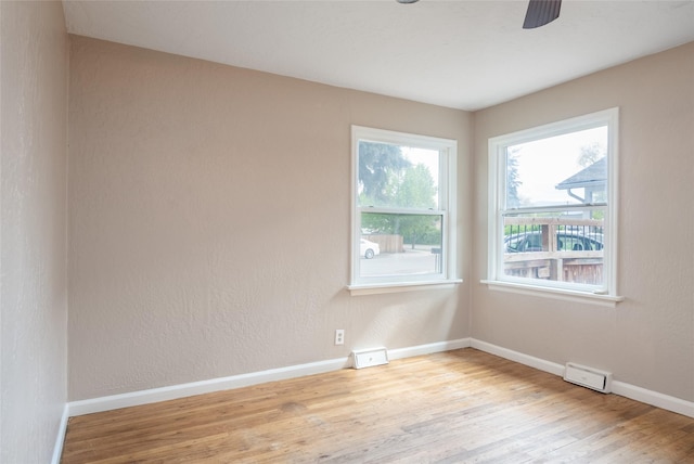 2109 S 5th St W, Missoula, MT 59801 - empty room with wood finished floors, baseboards, and a ceiling fan