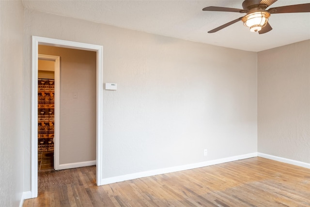 2109 S 5th St W, Missoula, MT 59801 - spare room with wood finished floors, ceiling fan, and baseboards