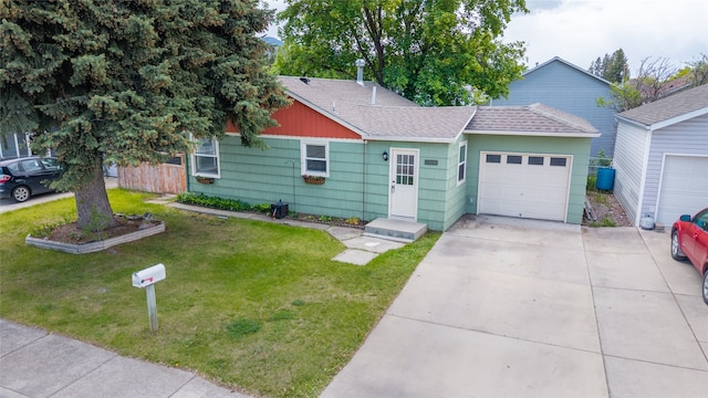 2109 S 5th St W, Missoula, MT 59801 - view of front facade with a shingled roof, a garage, driveway, and a front yard