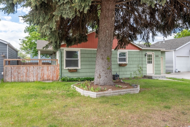 2109 S 5th St W, Missoula, MT 59801 - view of front of property with a front lawn and an attached garage