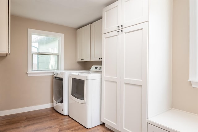 2109 S 5th St W, Missoula, MT 59801 - laundry room with cabinet space, separate washer and dryer, light wood-style floors, and baseboards