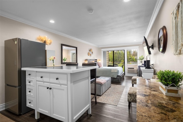 180 Vista Ln Unit 152, Bigfork, MT 59911 - bedroom featuring ornamental molding, freestanding refrigerator, dark wood finished floors, and recessed lighting