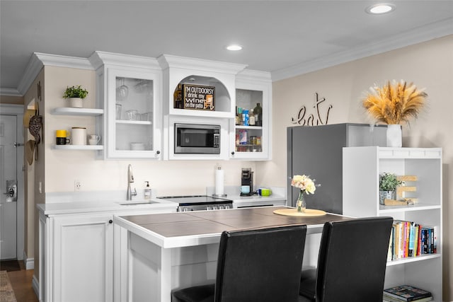 180 Vista Ln Unit 152, Bigfork, MT 59911 - bar with stainless steel appliances, crown molding, recessed lighting, and dark wood-style floors