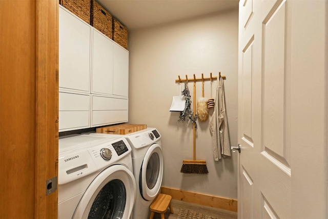 1245 Waverly St Unit 301, Missoula, MT 59802 - laundry area with cabinet space, washing machine and dryer, and baseboards