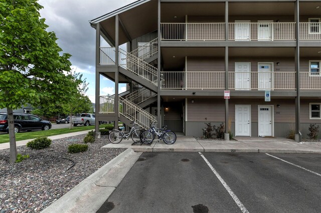 1245 Waverly St Unit 301, Missoula, MT 59802 - view of building exterior with uncovered parking and stairs