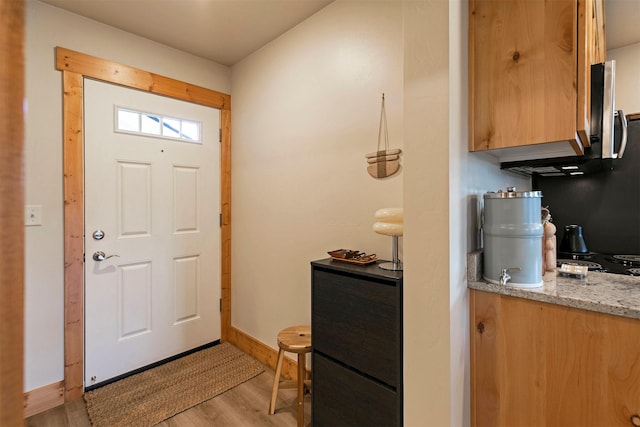 1245 Waverly St Unit 301, Missoula, MT 59802 - foyer with light wood-style floors and baseboards