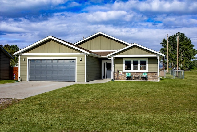 435 6th Ave NW, Ronan, MT 59864 - craftsman-style house with concrete driveway, an attached garage, and board and batten siding