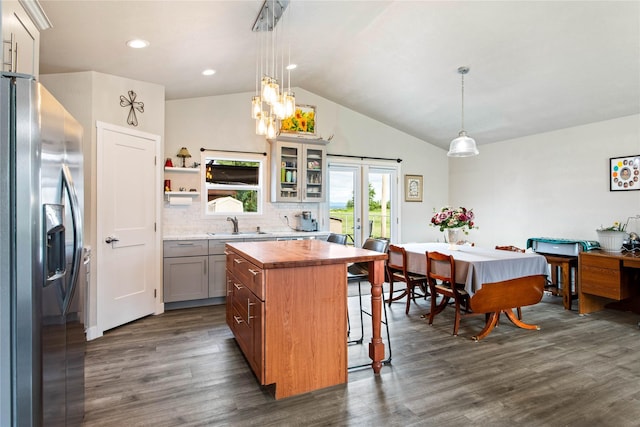 435 6th Ave NW, Ronan, MT 59864 - kitchen featuring stainless steel refrigerator with ice dispenser, butcher block countertops, dark wood-type flooring, lofted ceiling, and a breakfast bar