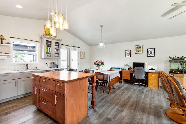 435 6th Ave NW, Ronan, MT 59864 - kitchen featuring vaulted ceiling, a sink, wood counters, dark wood-style flooring, and tasteful backsplash