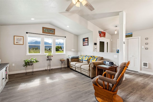 435 6th Ave NW, Ronan, MT 59864 - living area with ceiling fan, wood finished floors, vaulted ceiling, and baseboards
