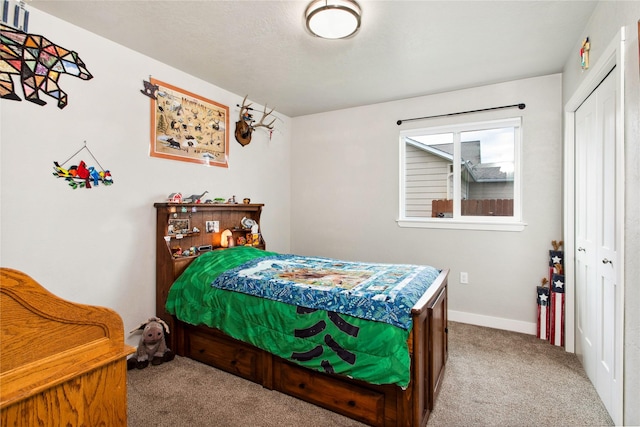 435 6th Ave NW, Ronan, MT 59864 - bedroom with carpet floors, a closet, and baseboards