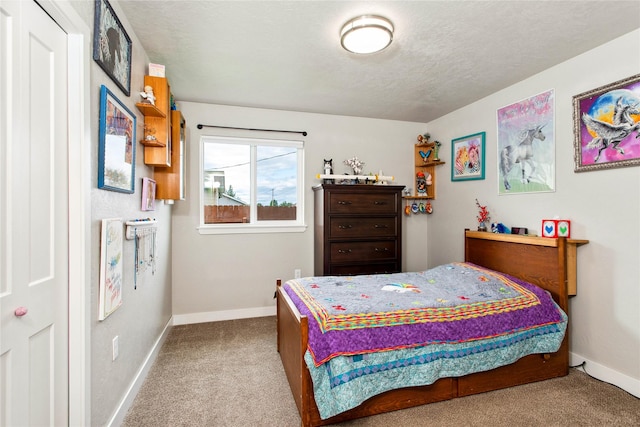 435 6th Ave NW, Ronan, MT 59864 - carpeted bedroom with baseboards and a textured ceiling